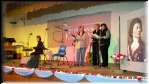 Paul Dion with his  group  singing  on a stage decorated by Gen. Kosciuszko's portrait and... apples from Les Strzelecki's orchard.