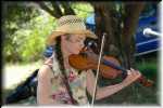 Evelyn Finnerty playing on fiddle.