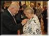 Ernestyna receiving her medal Honoris Gratia from the Mayor Of Krakow during a farewell dinner at the Historical Museum.